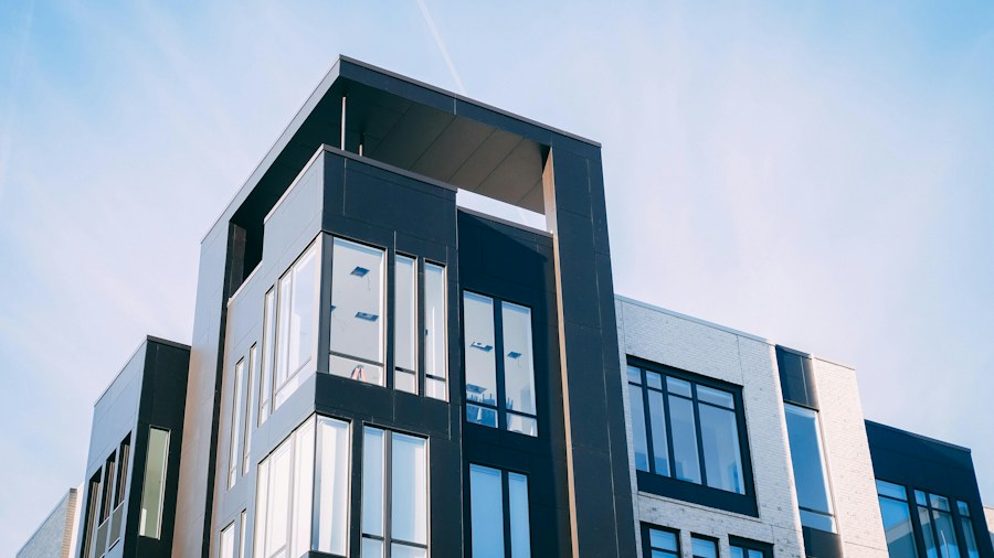 A modern workplace building beneath a blue sky