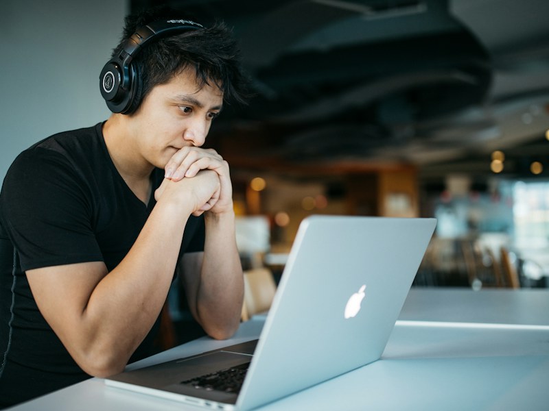 A learner concentrating at a laptop