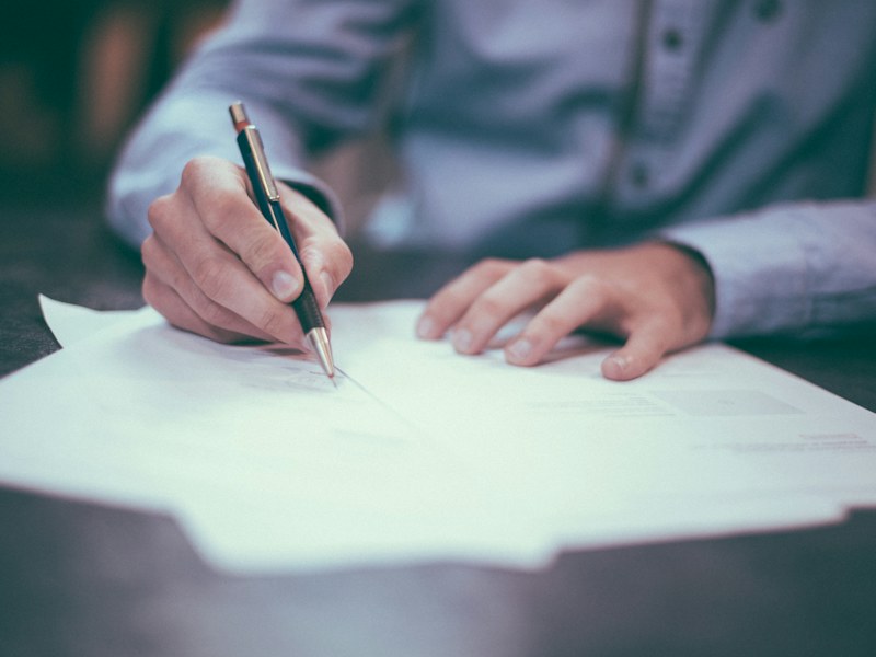 A person completing paperwork