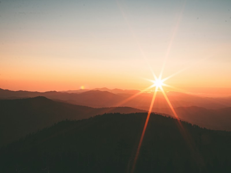 Sunrise over distant hills