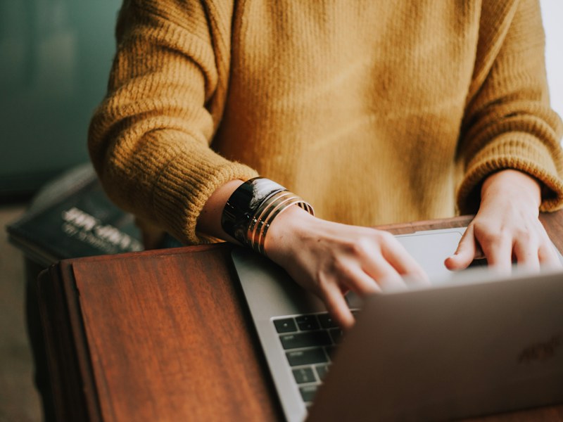 A person studying at a laptop