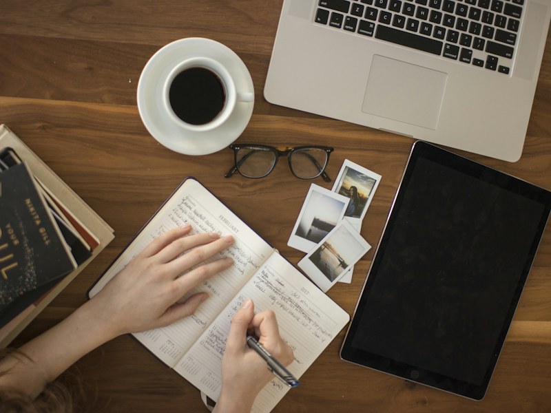 Overhead view of a learner taking notes